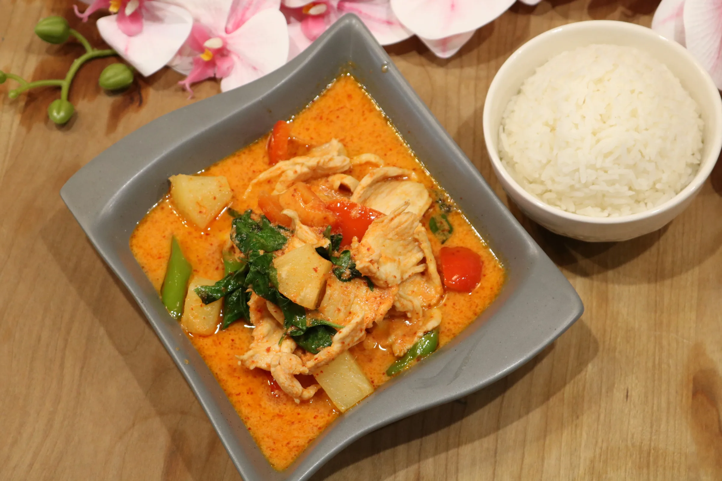 Red curry served with steamed rice